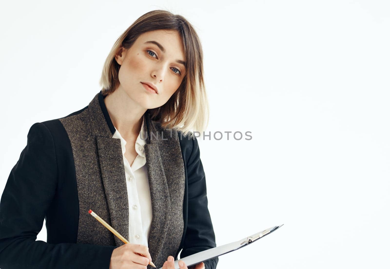 Woman in a suit In a bright room with documents in hands by SHOTPRIME