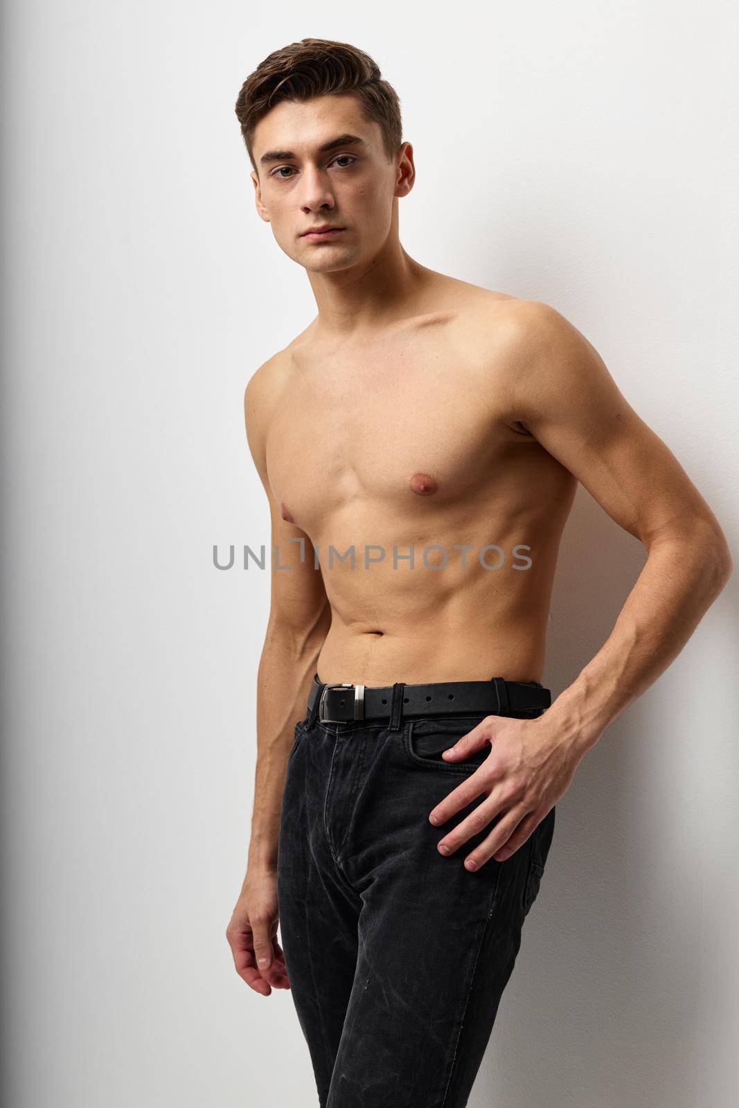Handsome man with naked torso posing self-confidence model. High quality photo