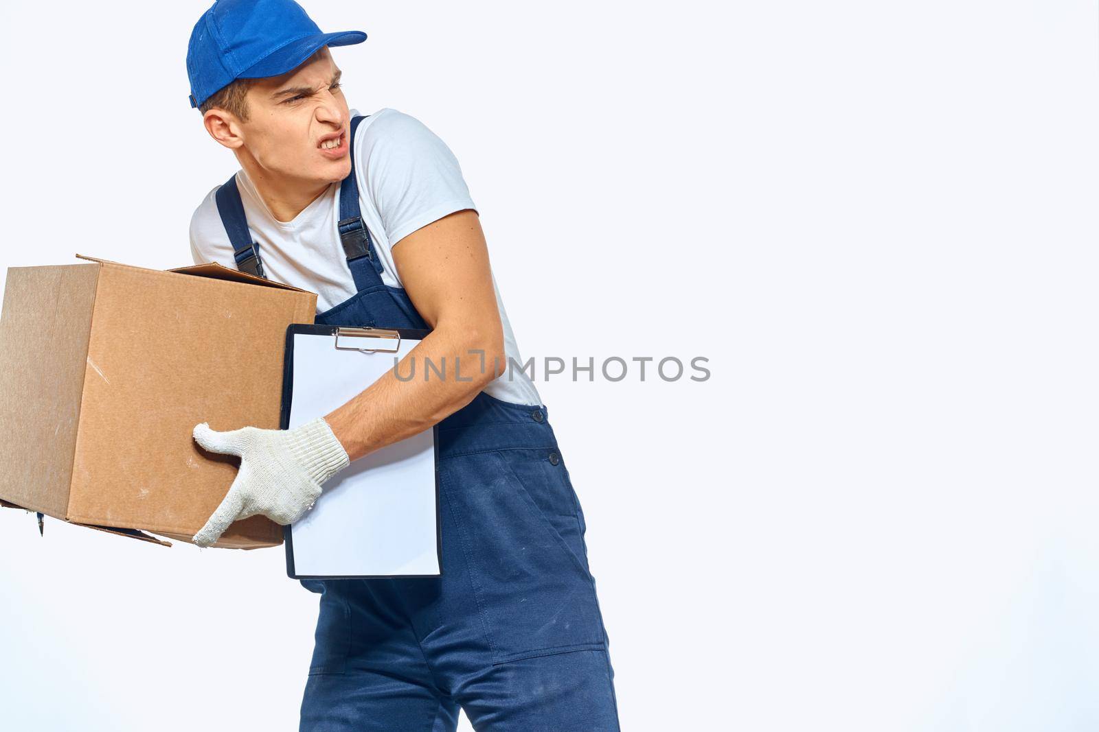 man in working uniform work transportation loader light background by SHOTPRIME