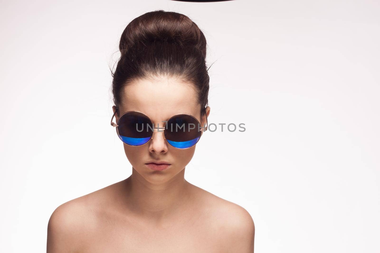 woman with bare shoulders sunglasses fashion cropped view light background by SHOTPRIME