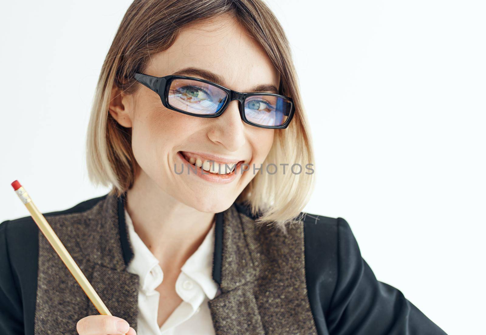 Happy woman with a pencil and glasses on a light background business finance by SHOTPRIME