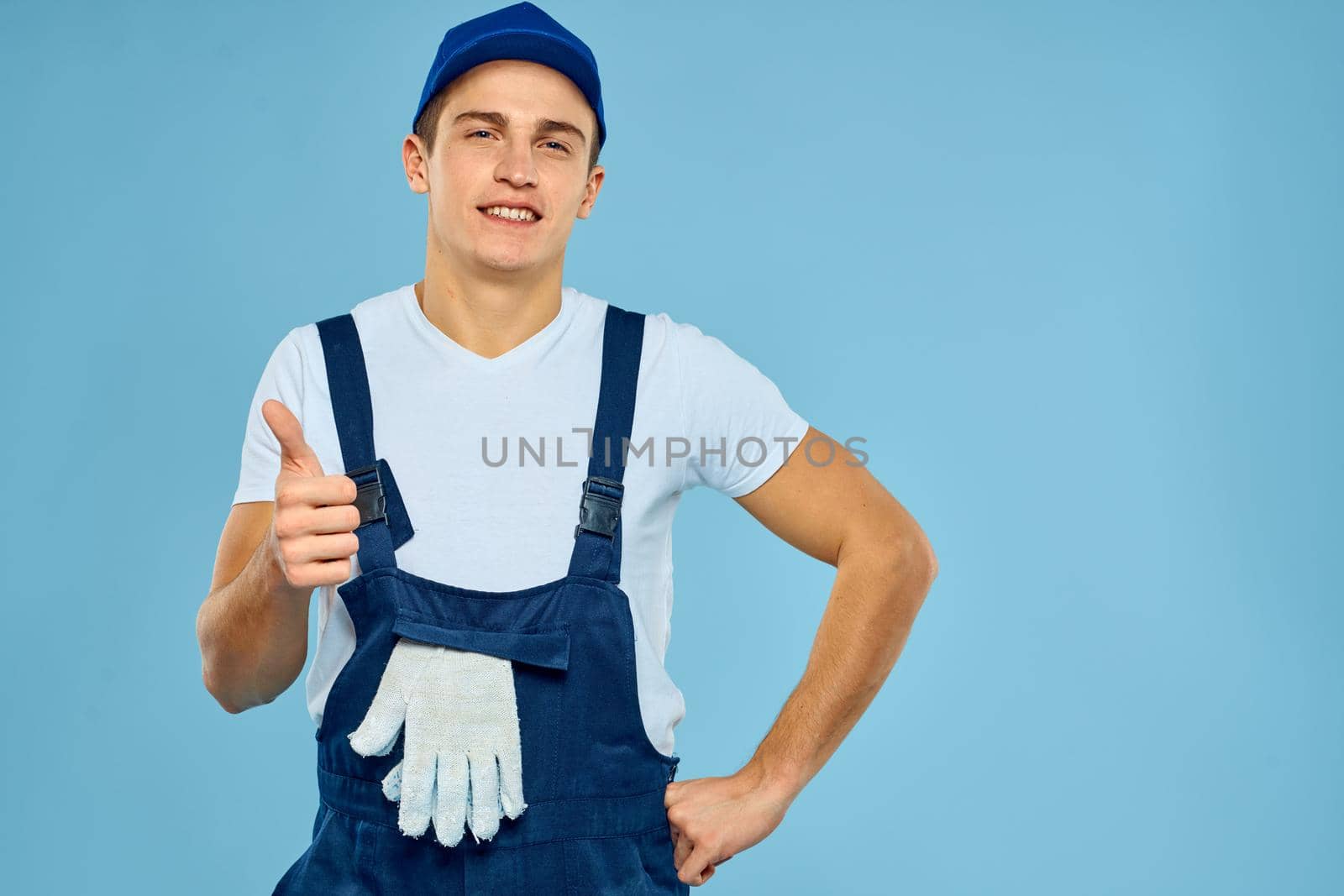 Working man uniform delivery service blue background by SHOTPRIME