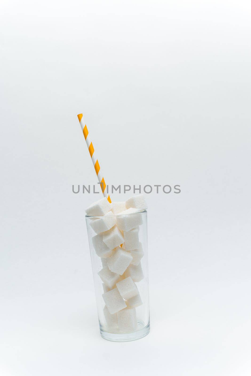 sugar cubes in a glass with a tube high-calorie cocktail. High quality photo