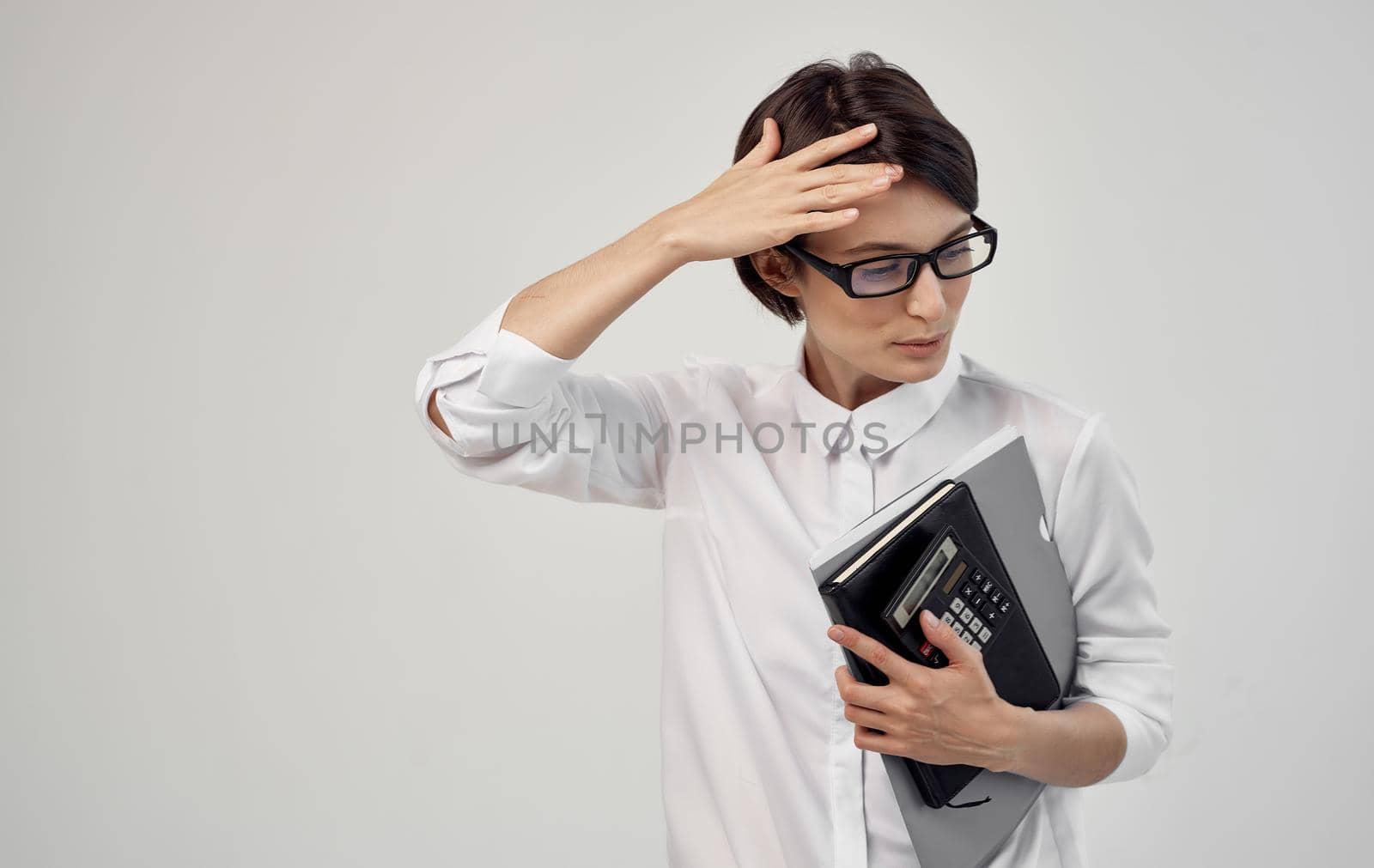 woman with documents in hand and wearing glasses cropped view. High quality photo