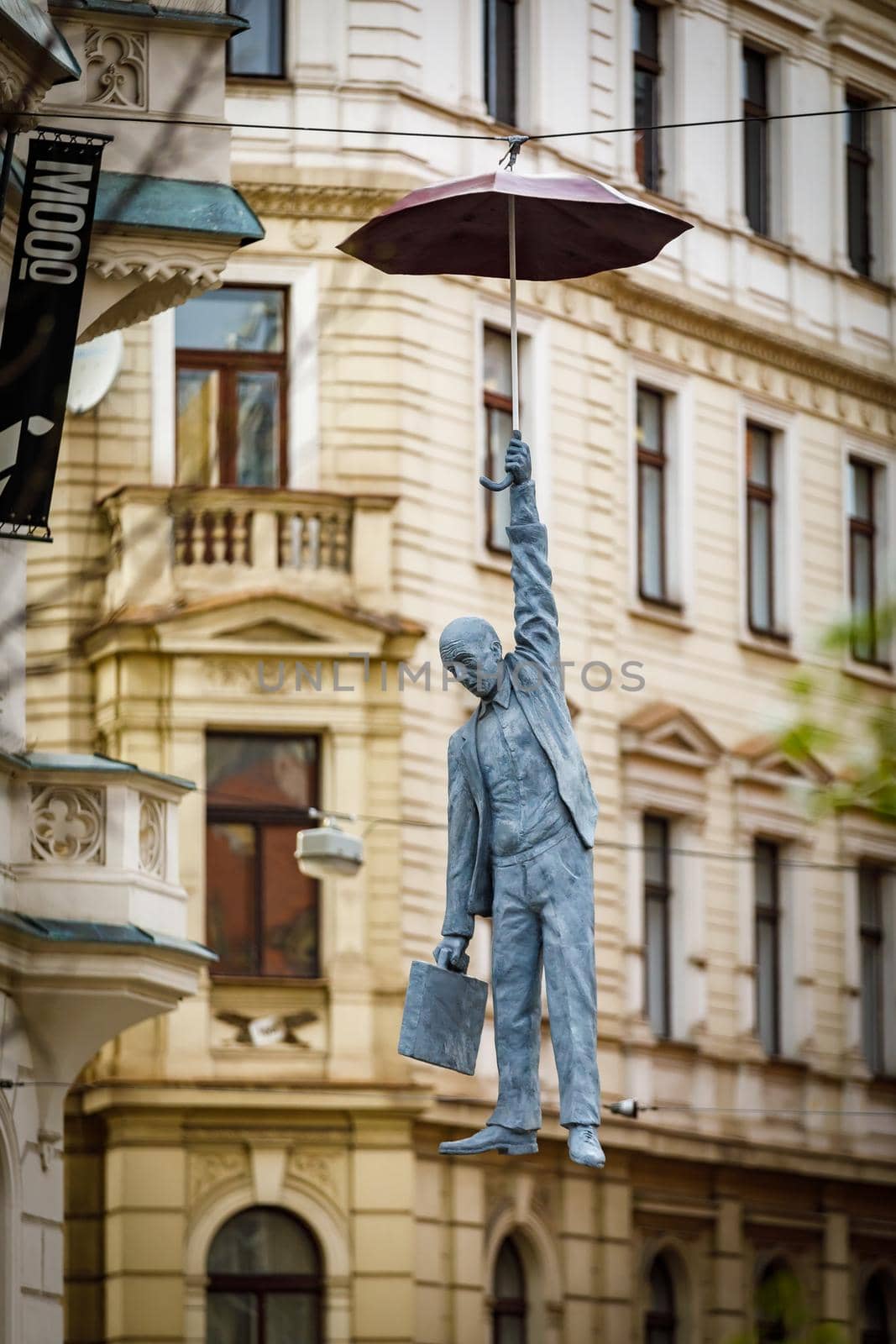 Prague, Czech Republic April 14, 2018. Sculpture of a Hanged Man with an Umbrella, titled Little Uncertainty by Michal Trpak in Prague Czech Republic