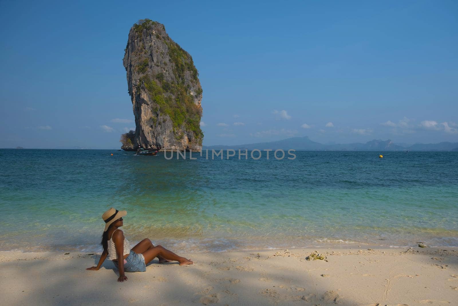 Koh Poda Island Thailand, Asian woman on the beach, Koh Poda Thailand, beautiful tropical beach of Koh Poda, Poda Island in Krabi province of Thailand South East Asian