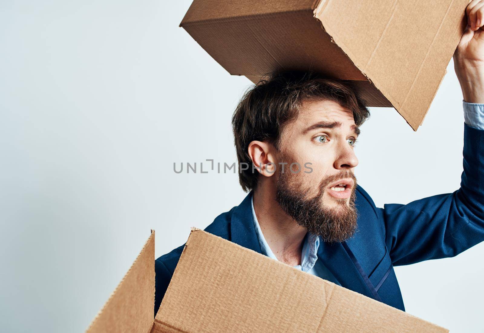 man with boxes in groups moving new place of work lifestyle official. High quality photo