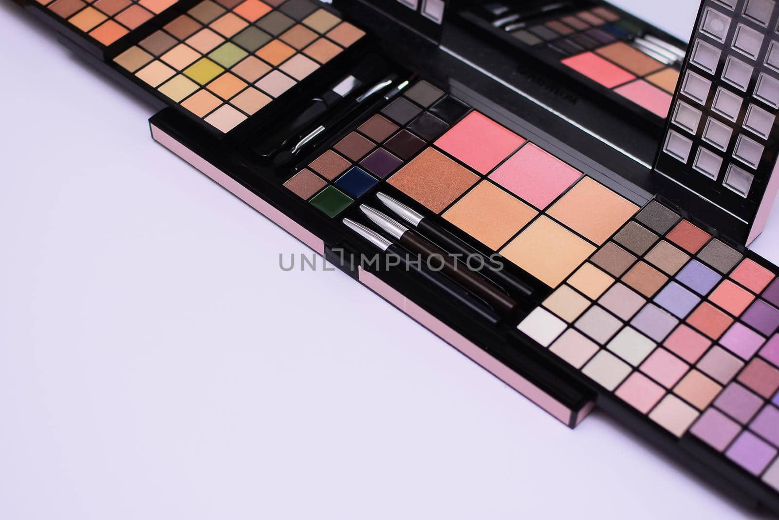 Eyeshadow palette on white background. eye shadows cosmetics product. Fashion blog design. Contouring palette. concept luxury beauty brand promotion and makeup. Makeup palette close up. mock up