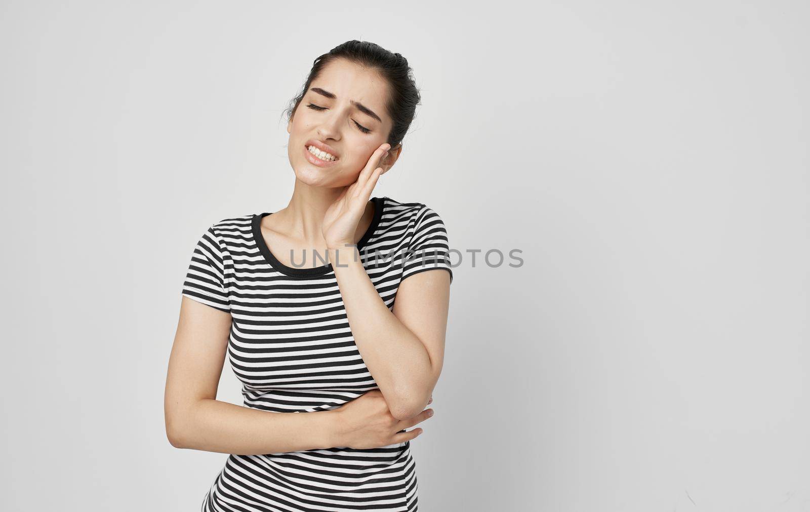 woman holding face dental problems pain dissatisfaction. High quality photo