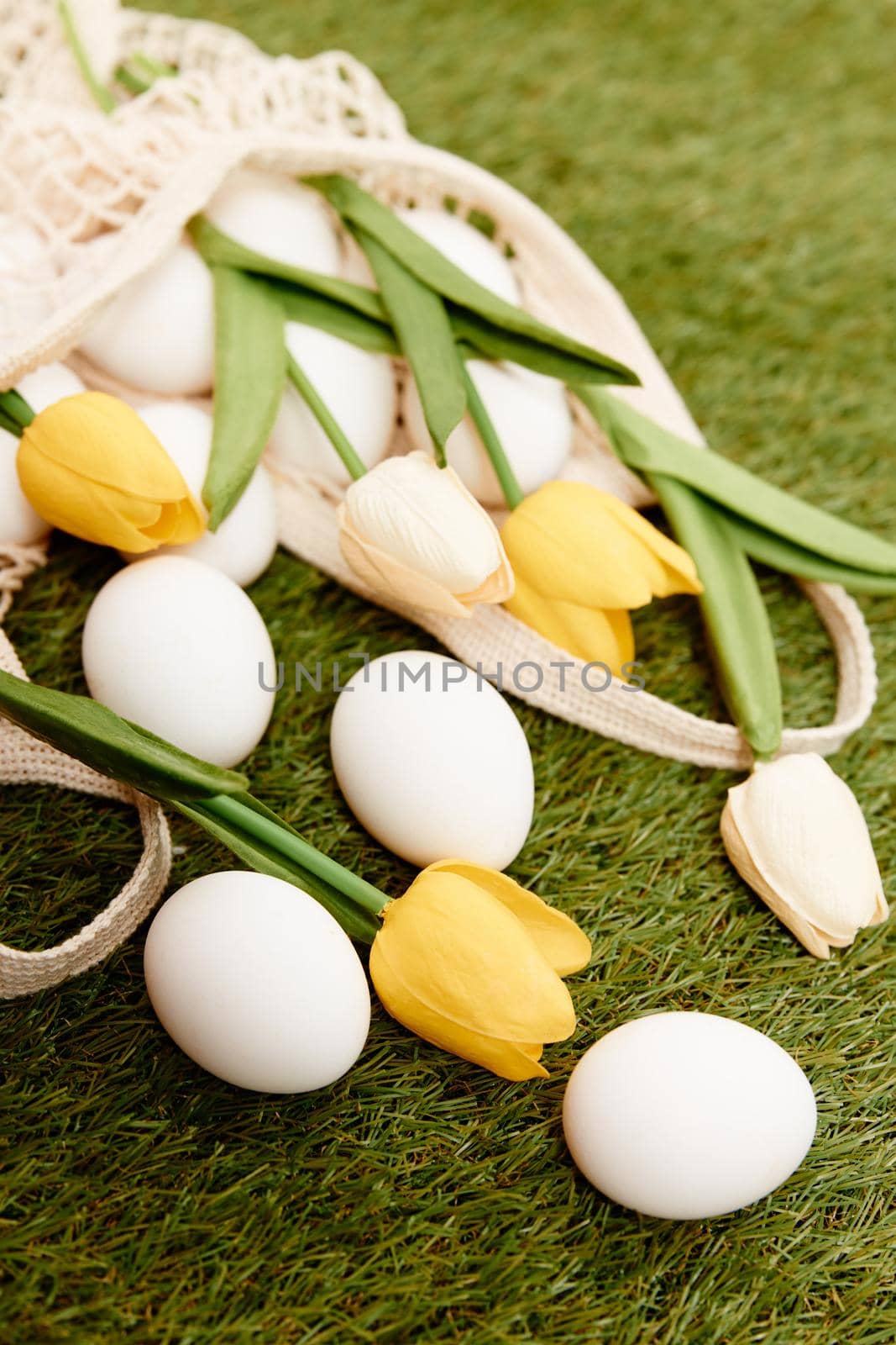 easter eggs bouquet flowers holiday tradition lawn background. High quality photo