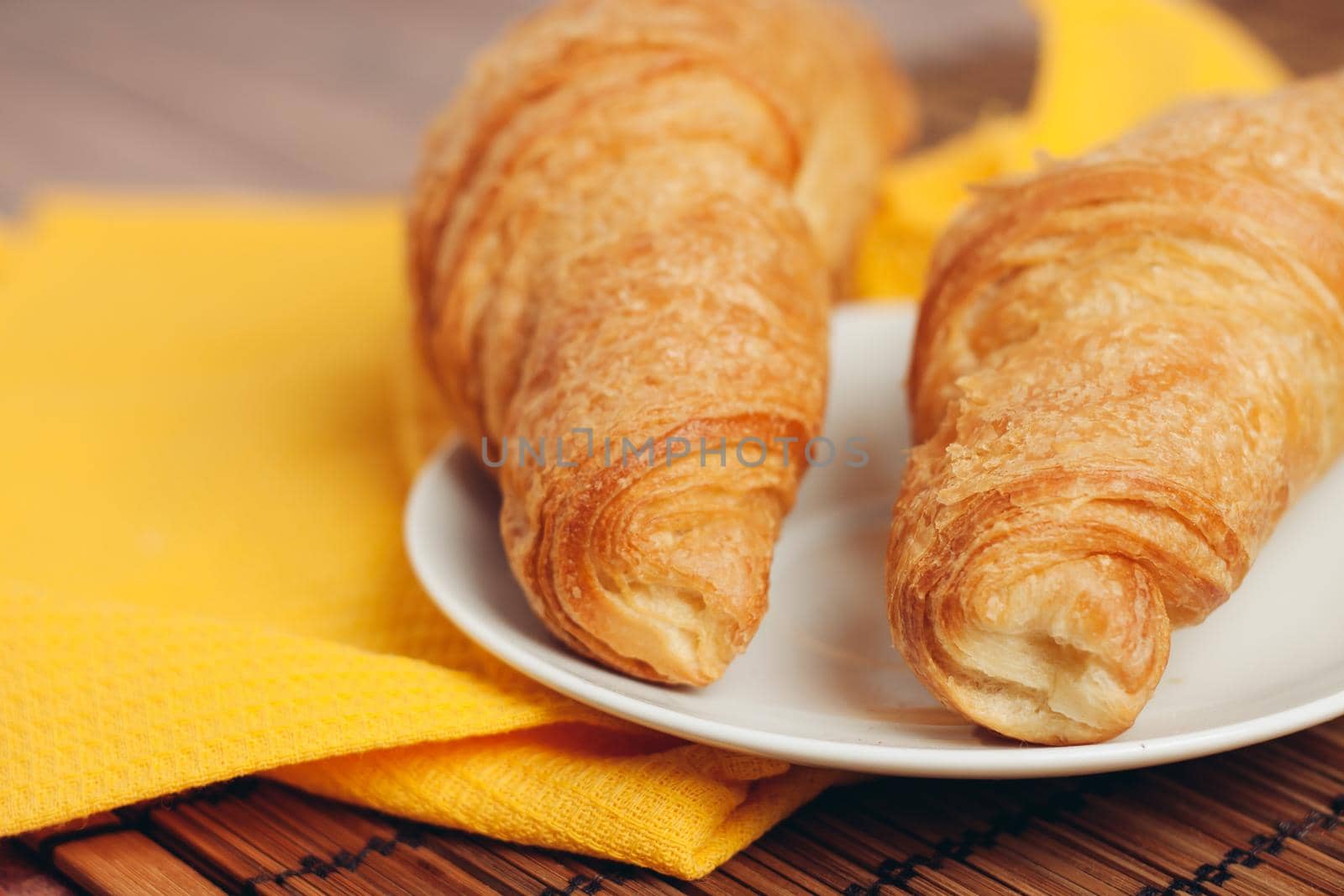croissants in a plate on the table flour dessert coffee meal. High quality photo
