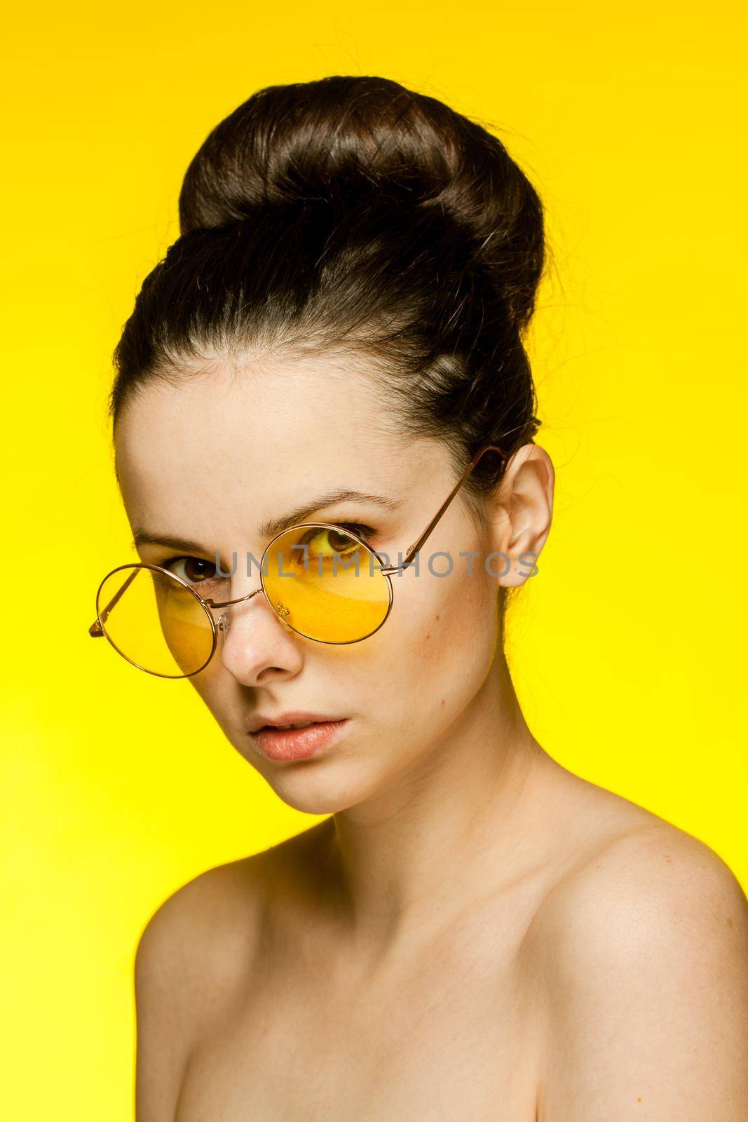 brunette with bare shoulders yellow glasses clear skin model by SHOTPRIME