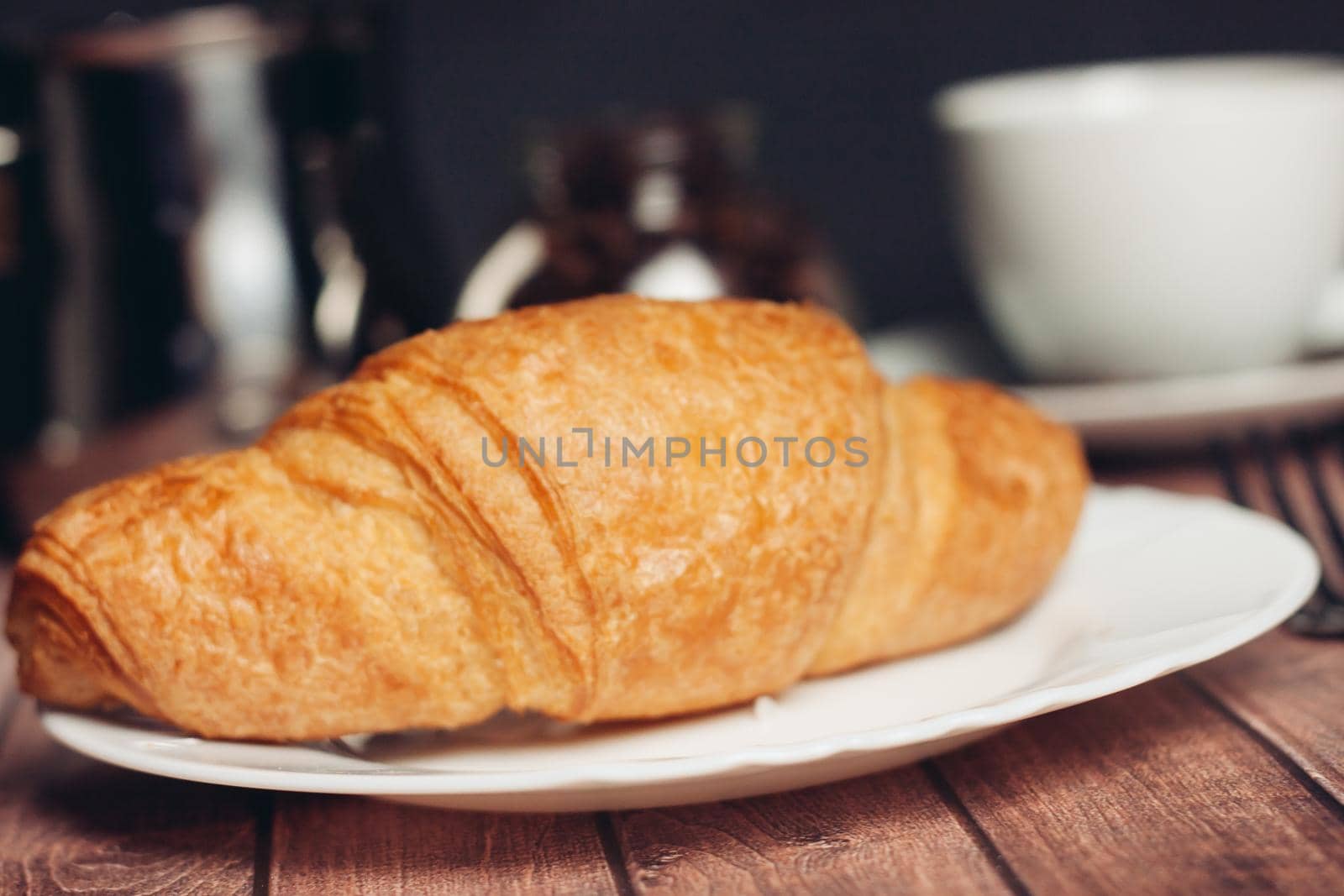 croissants in a plate a cup with a drink a meal dessert snack by SHOTPRIME
