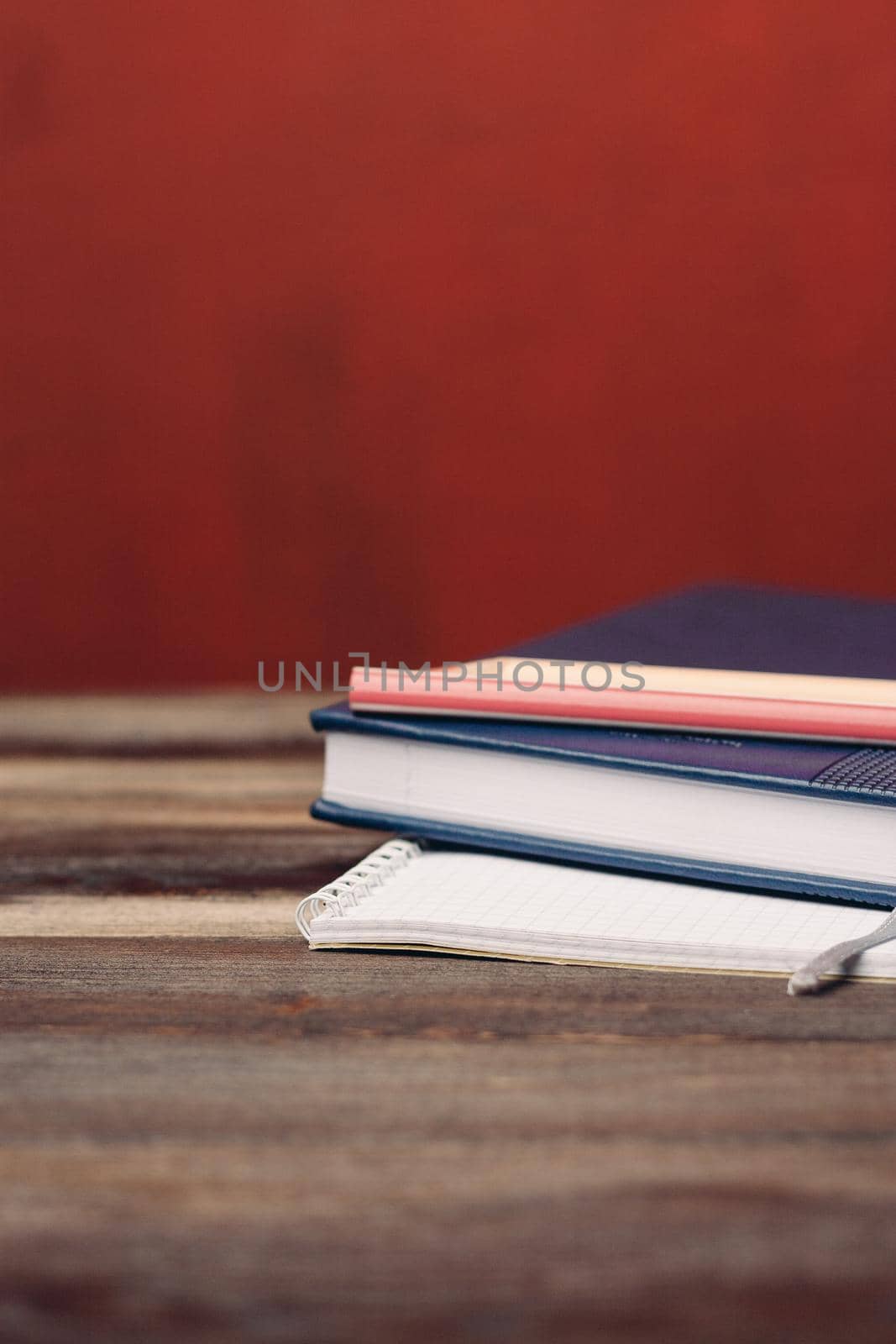 books notepads pens on wooden table pencil office writing by SHOTPRIME