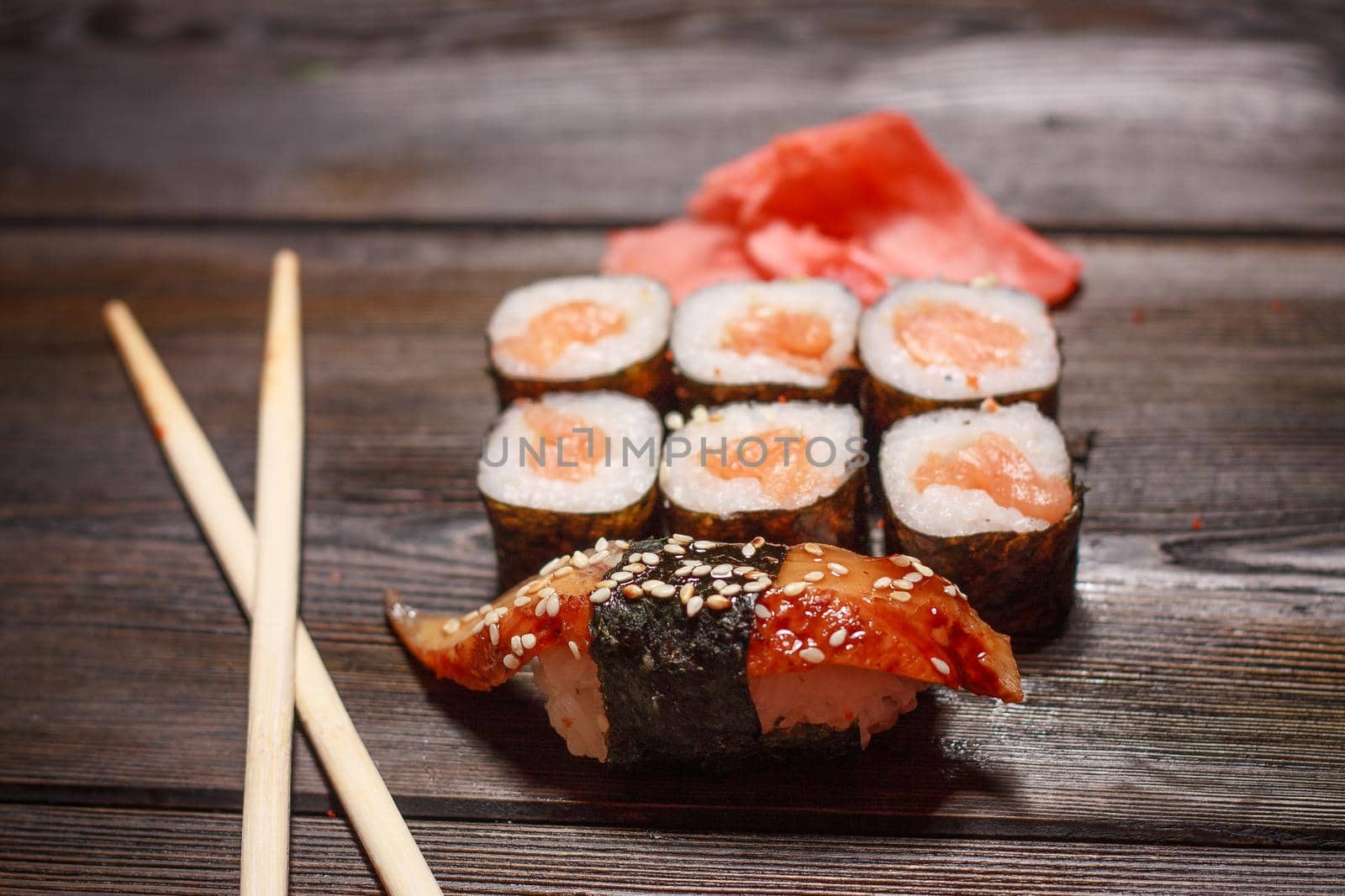 asian cuisine sushi rolls wooden sticks wasabi ginger seafood. High quality photo