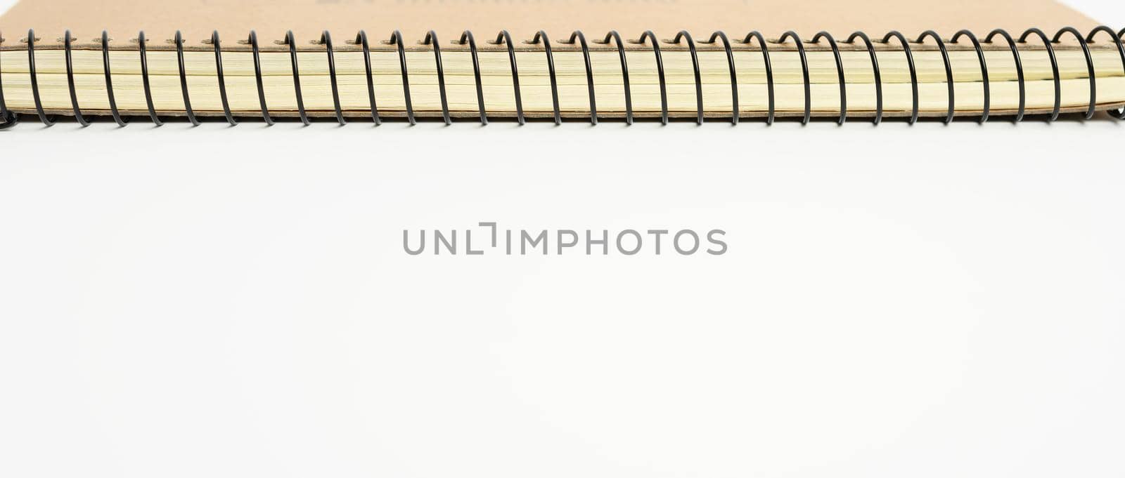 open spiral notebook with blank white sheets, close up