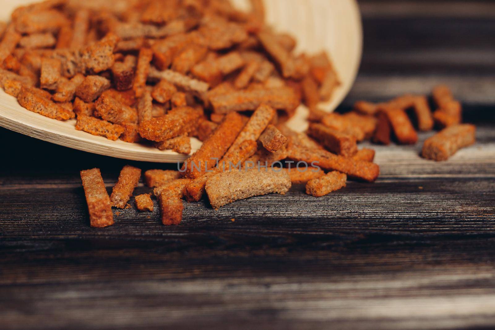 salty croutons snacks delicacy meal wooden table. High quality photo
