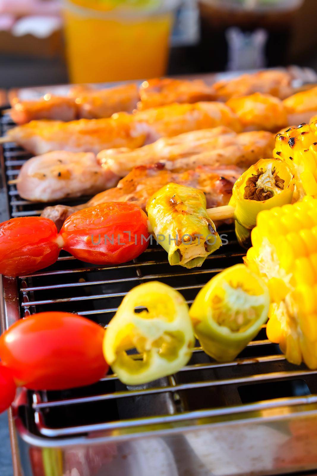 Closeup image of Grilled vegetable and chicken skewers on a hot barbecue