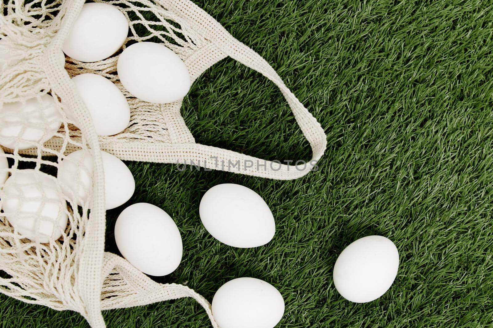 eggs in a bag lie on the lawn Easter holiday Christian day. High quality photo