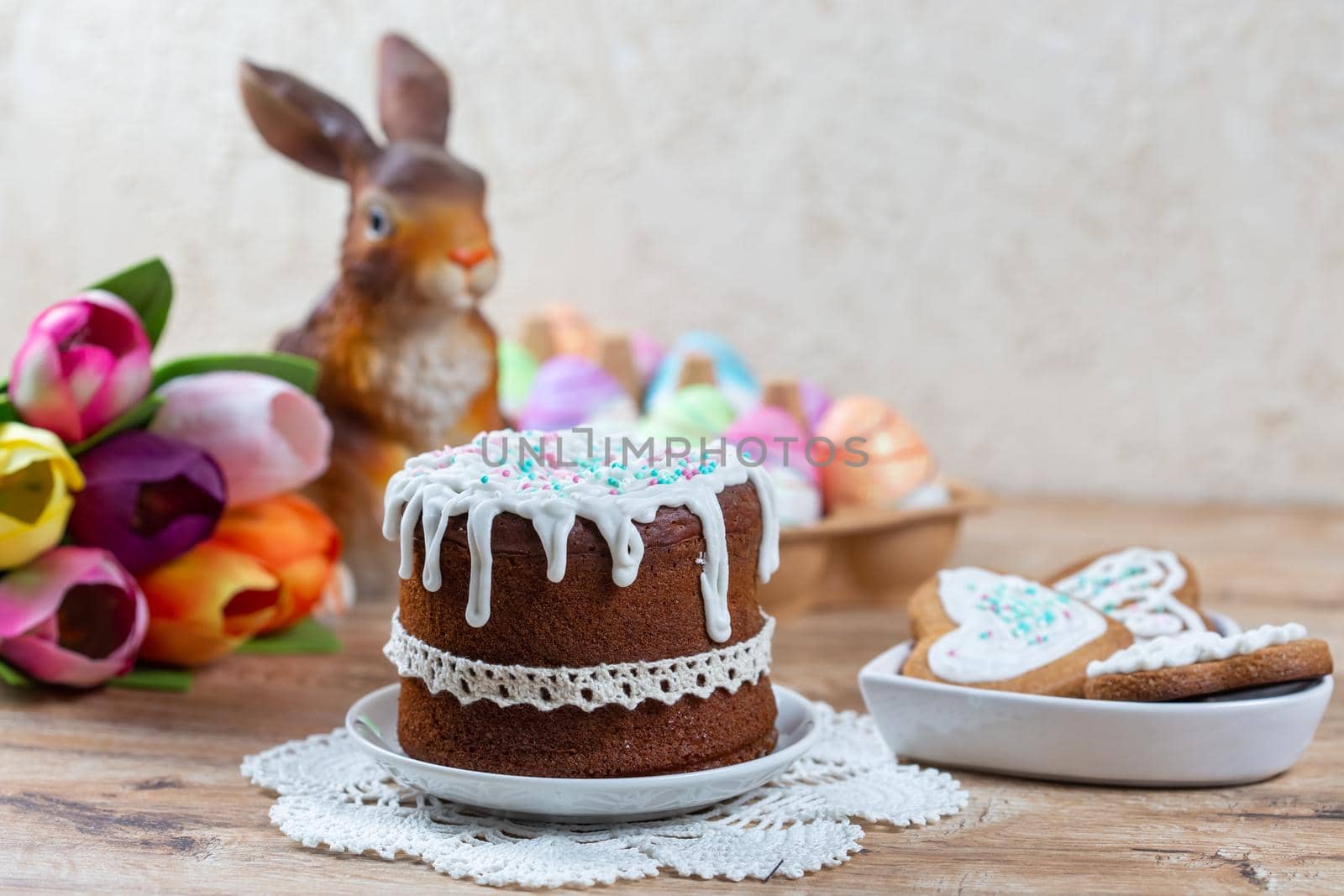 Easter still life with cake, homemade cookies, decorative figurine of rabbit  by galinasharapova
