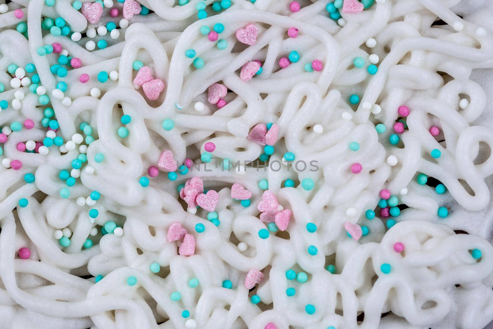 The texture of icing on a cake with pastry sprinkles, macro photography by galinasharapova