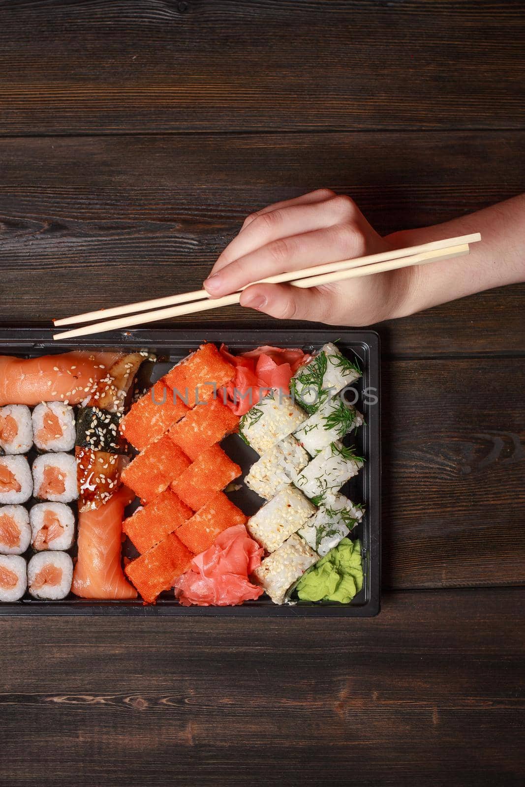 set of sushi and rolls on a wooden table asian food ginger wasabi japanese cuisine by SHOTPRIME