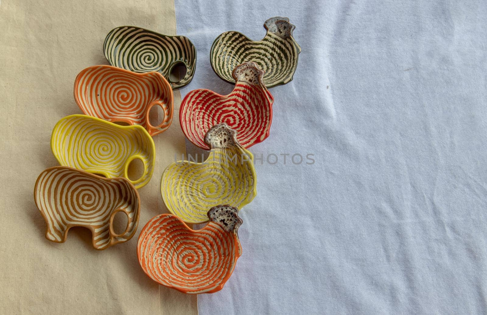 Set of Chickens and Elephants shaped ceramics cup to Decorate the house beautifully. Cup for dipping sauce, Copy space, Selective focus.