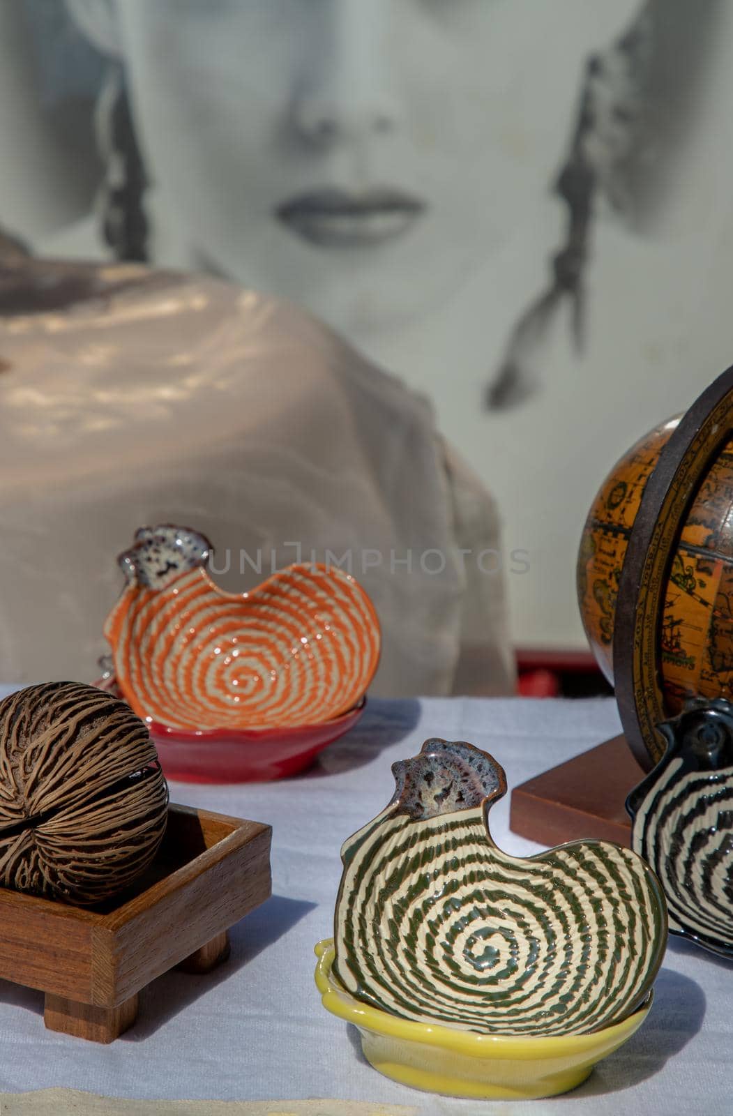 Set of Chickens shaped ceramics cup and Dried cerbera oddloam's seed to Decorate the house beautifully. Chickens shaped cup for dipping sauce, Selective focus.