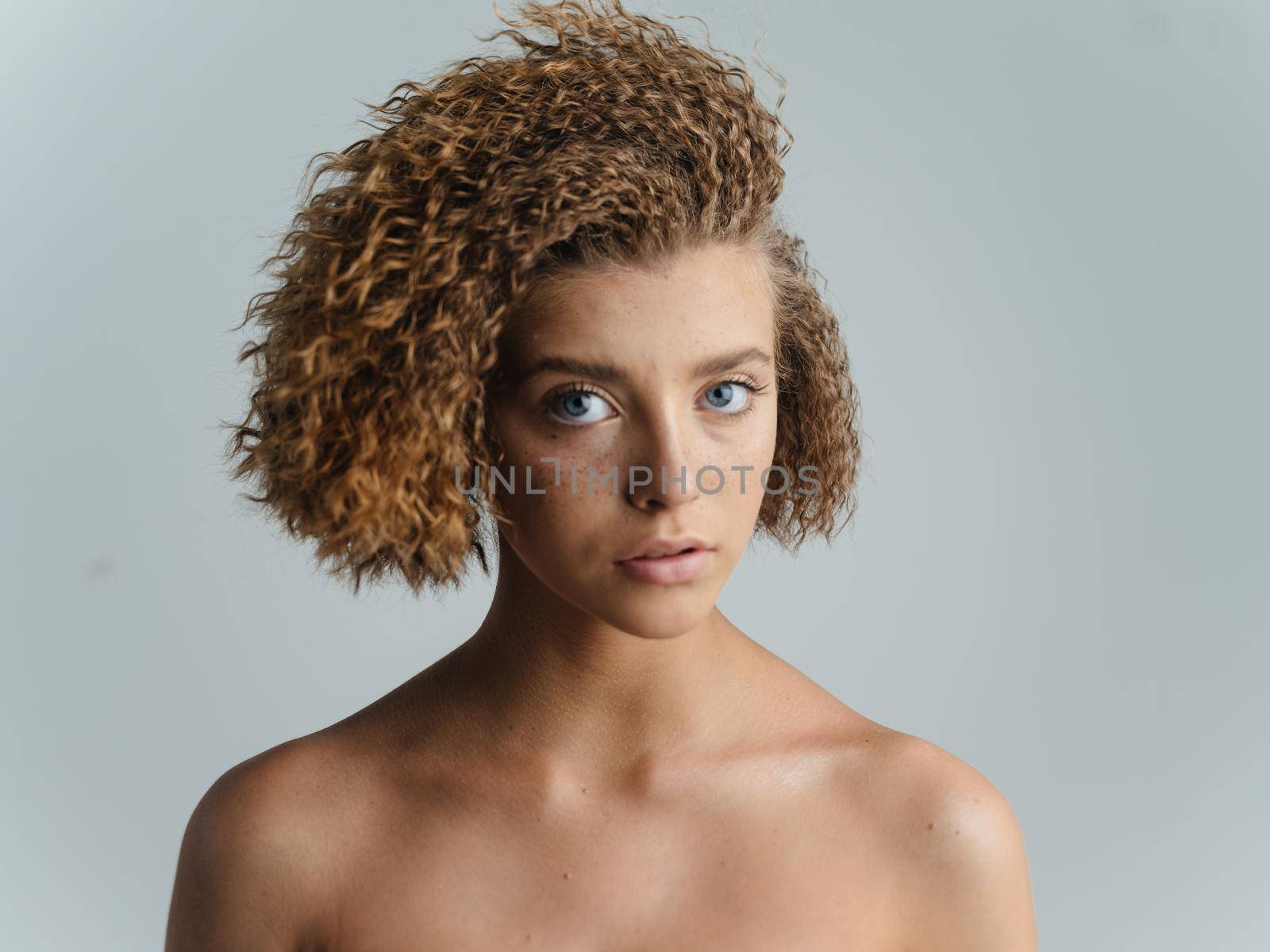 Woman with hair naked shoulders clean skin cosmetics model. High quality photo