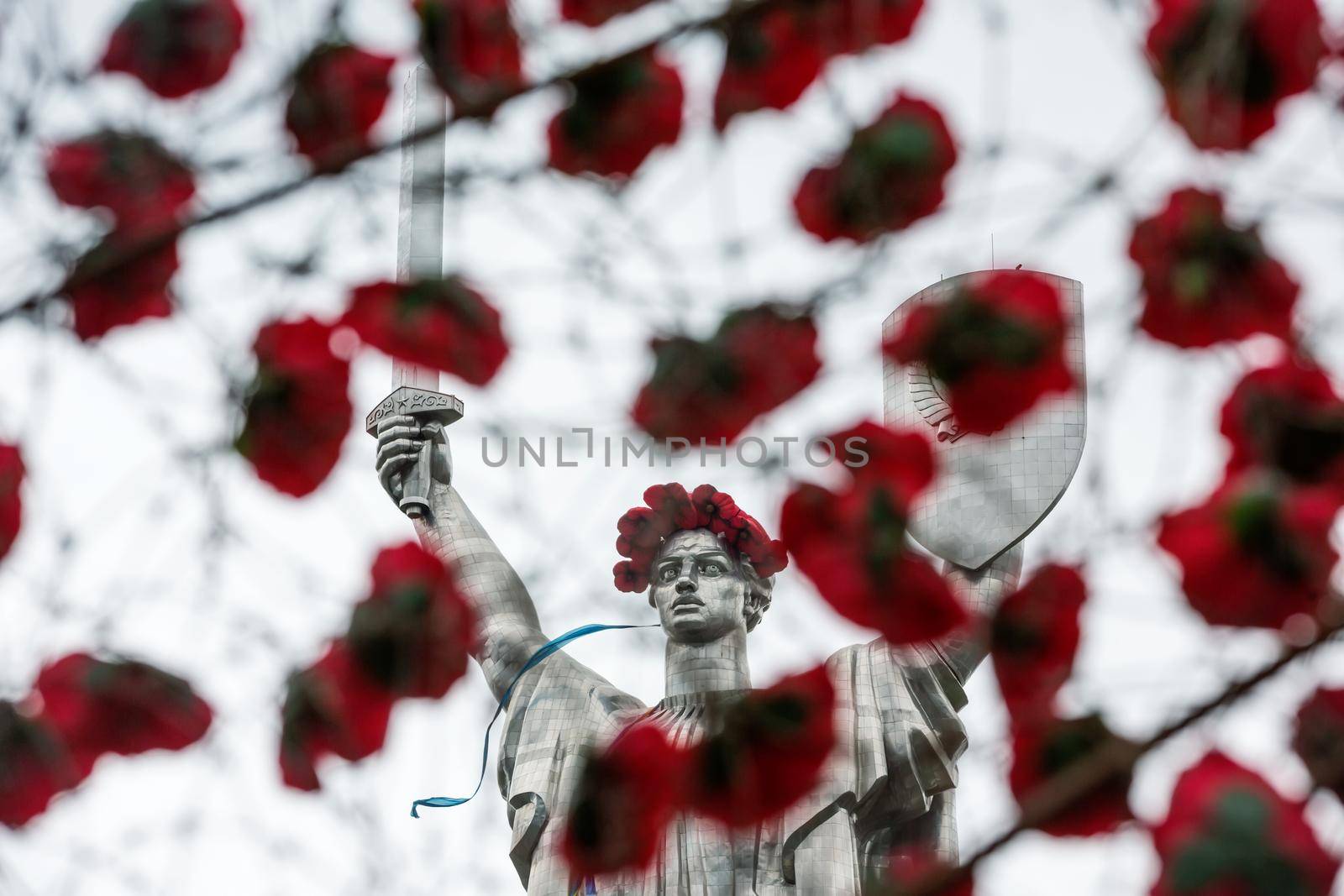 KIEV, UKRAINE - May. 08, 2015: Poppies of memory. The monument "Mother Motherland" decorated with a wreath of poppies on the Day of Remembrance and Reconciliation in Kiev