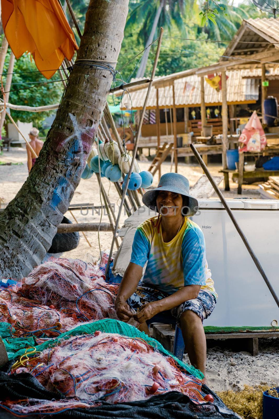 Koh Phitak , Chumphon province Thailand January 2020, fishing boats and small huts above the water, Koh Phitak a tradiional fishing village in Thailand Asia
