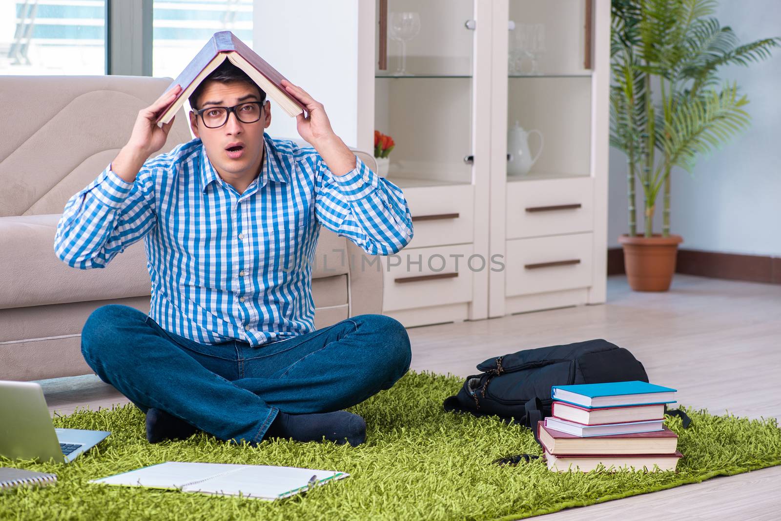 Student meditating and preparing for university exams by Elnur