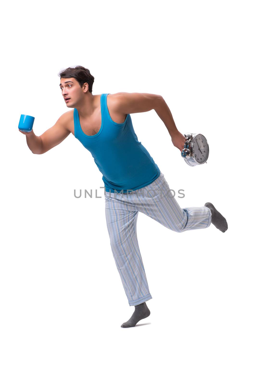 Man waking up with alarm clock isolated on white