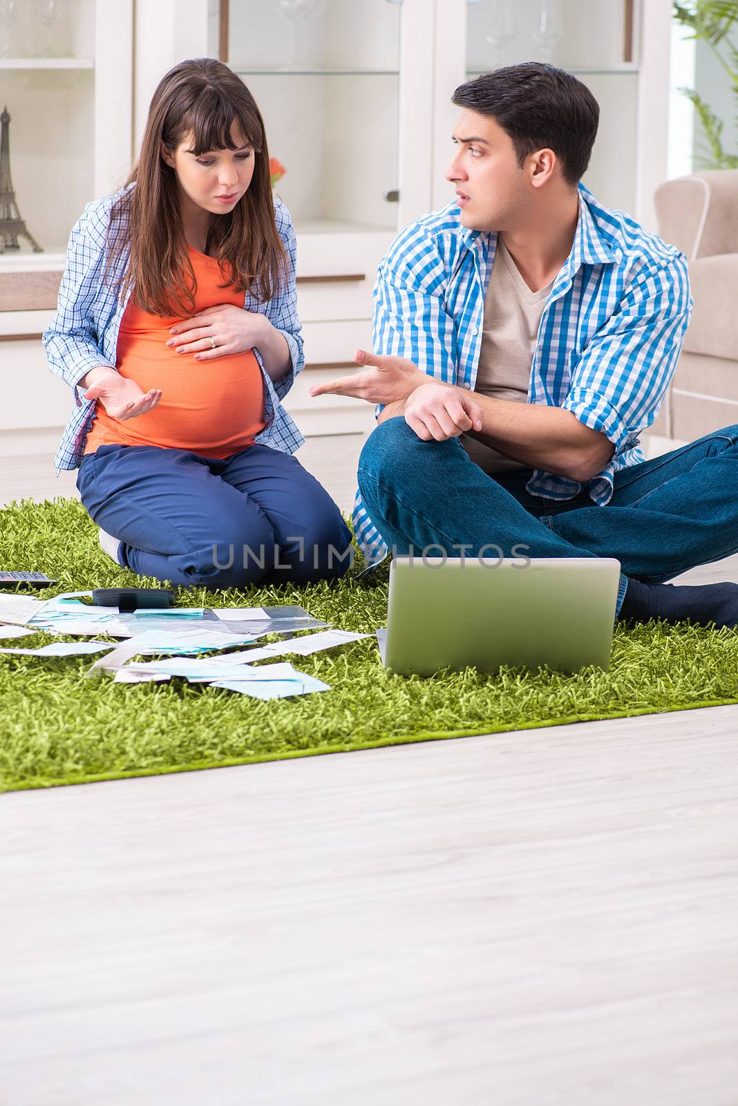 Young family in budget planning concept