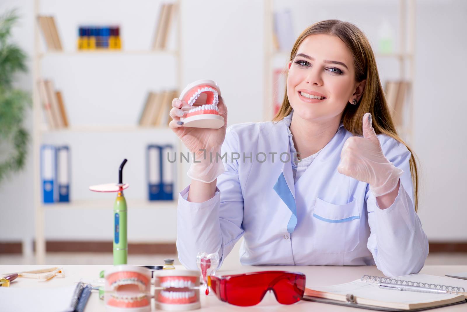Dentistry student practicing skills in classroom by Elnur