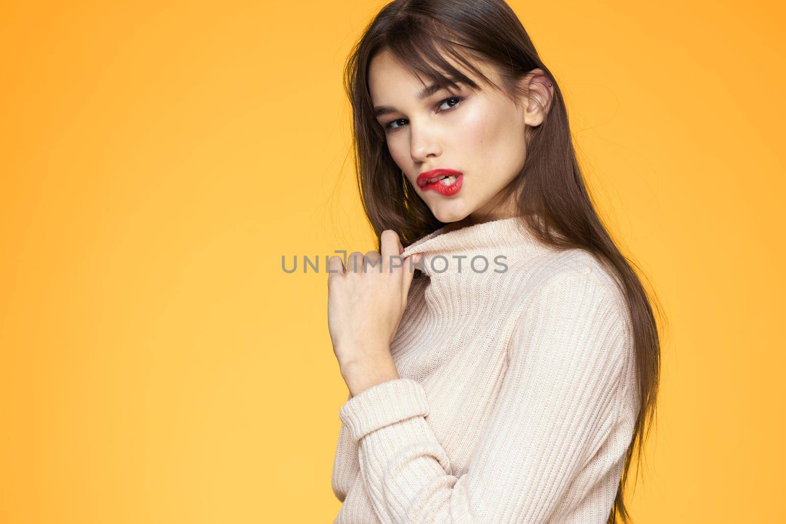 Cute brunette red lips fashionable clothes studio yellow background by SHOTPRIME