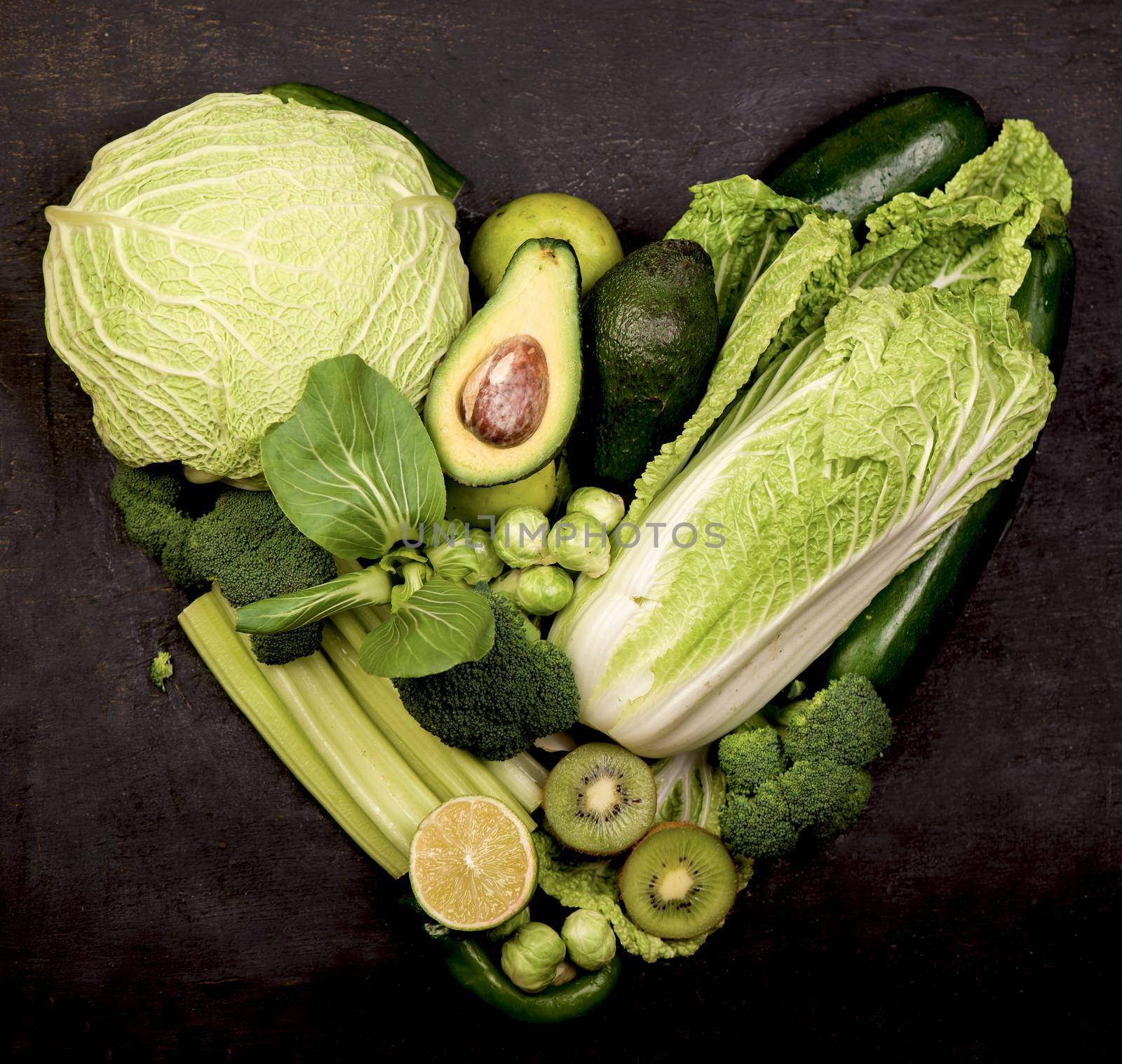 Mix of cabbages on white background: white cabbage, red cabbage, Savoy cabbage, Roman cabbage and Brussels sprouts. by aprilphoto