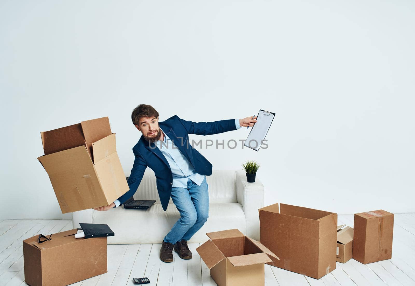 Business man picking up cardboard boxes and moving to a new place lifestyle. High quality photo