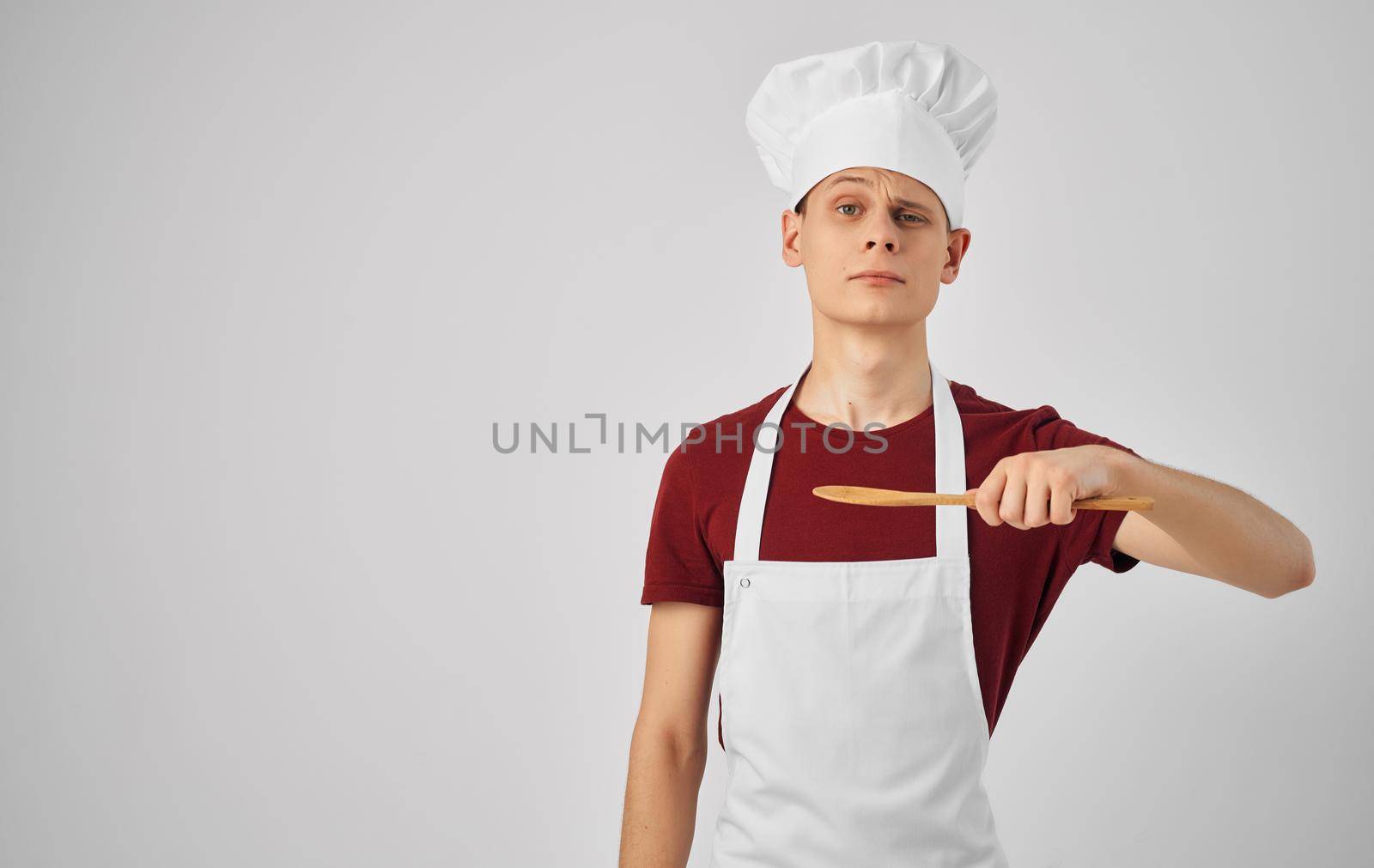 male chef with kitchen utensils cooking food service. High quality photo