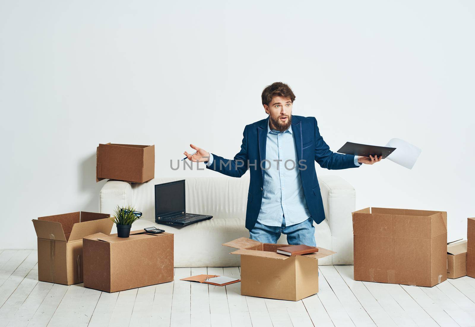 Business man unpacking boxes with things for an official Professional. High quality photo