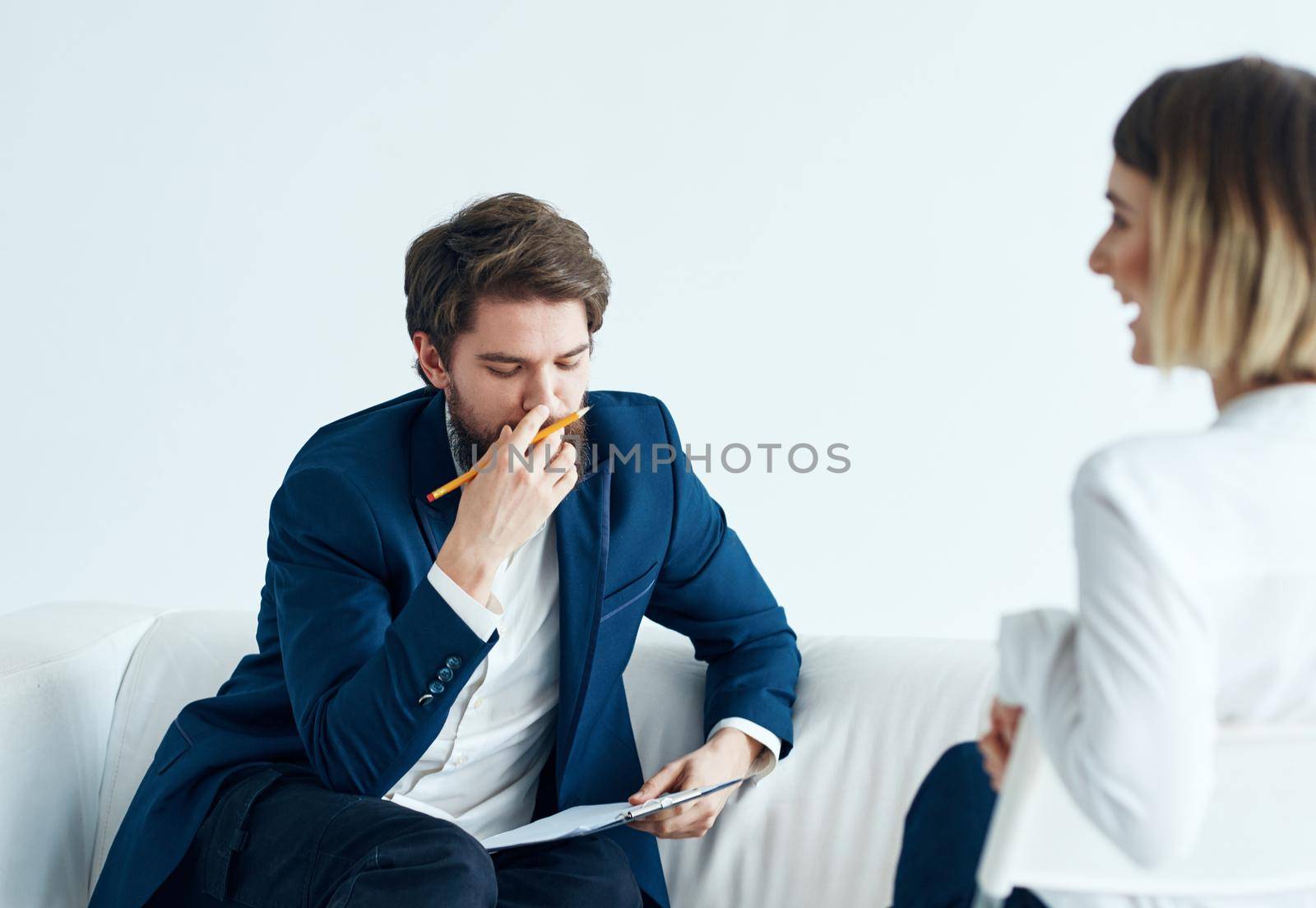 Employees communicate on a light background woman vacancies. High quality photo
