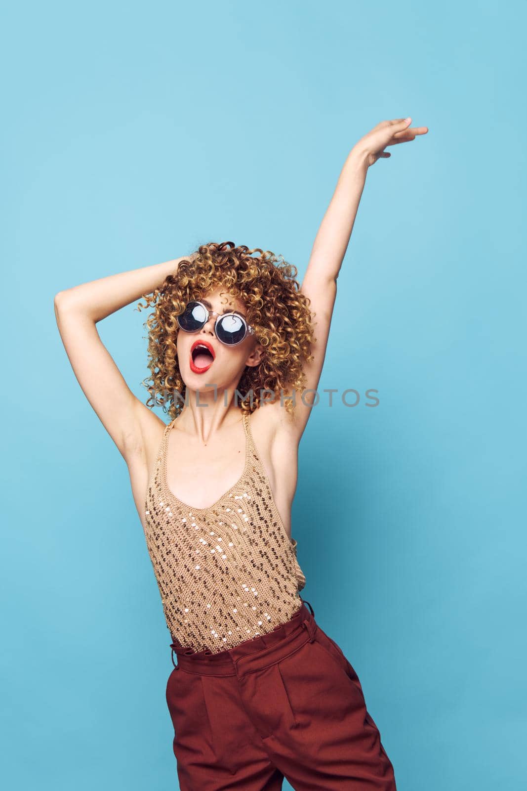 woman fun lifestyle emotions motion studio brown pants cropped view