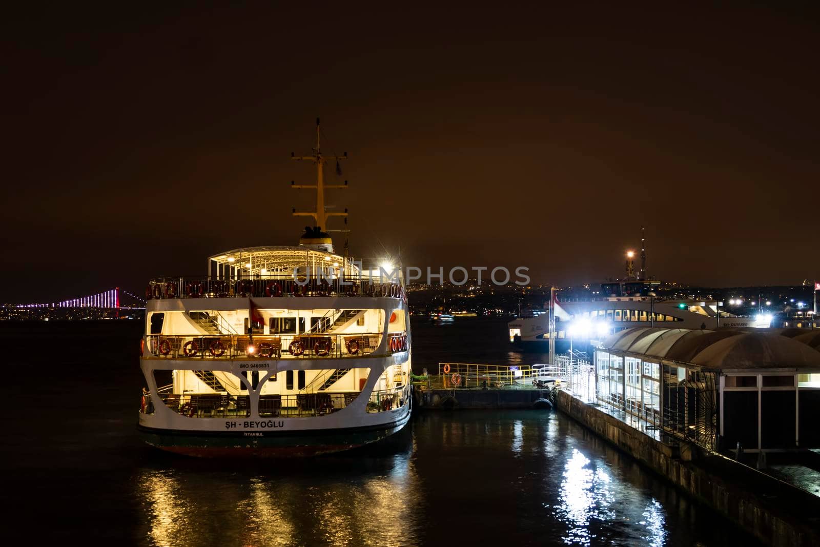 eminonu,istanbul,turkey-february 19,2021.city lines ferry at eminonu pier at dusk in the morning in istanbul city.