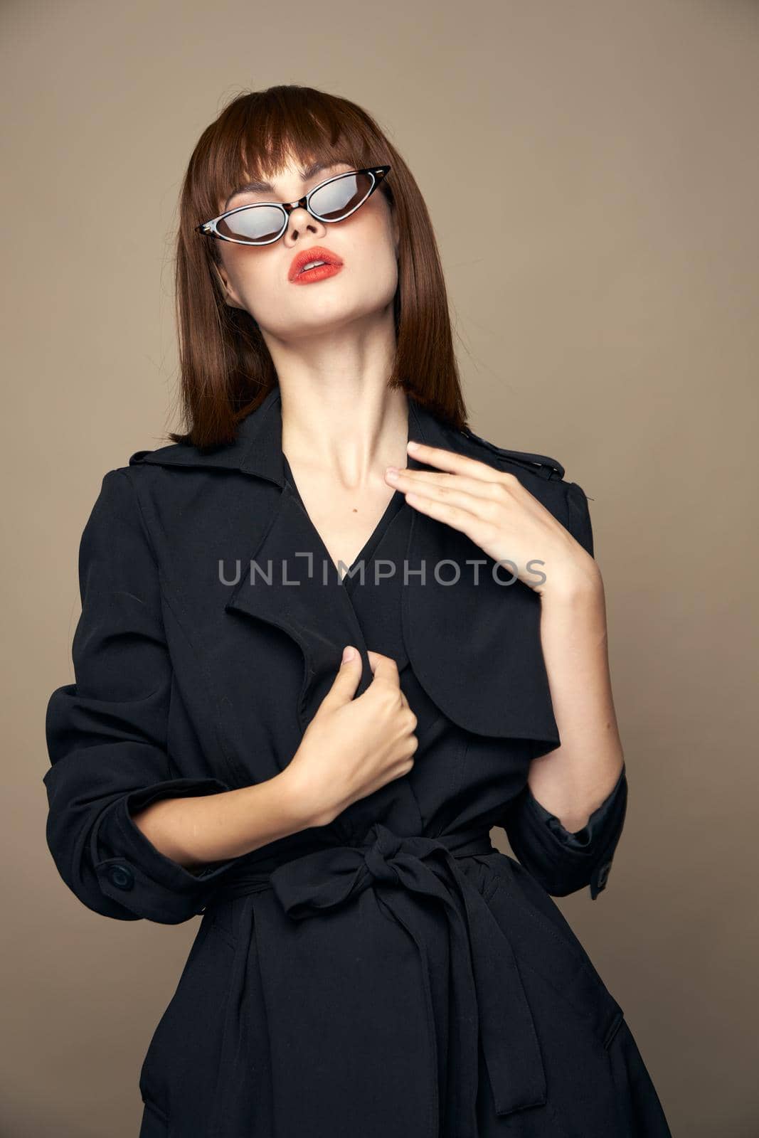 Brunette touches herself with hands on isolated background bright makeup by SHOTPRIME