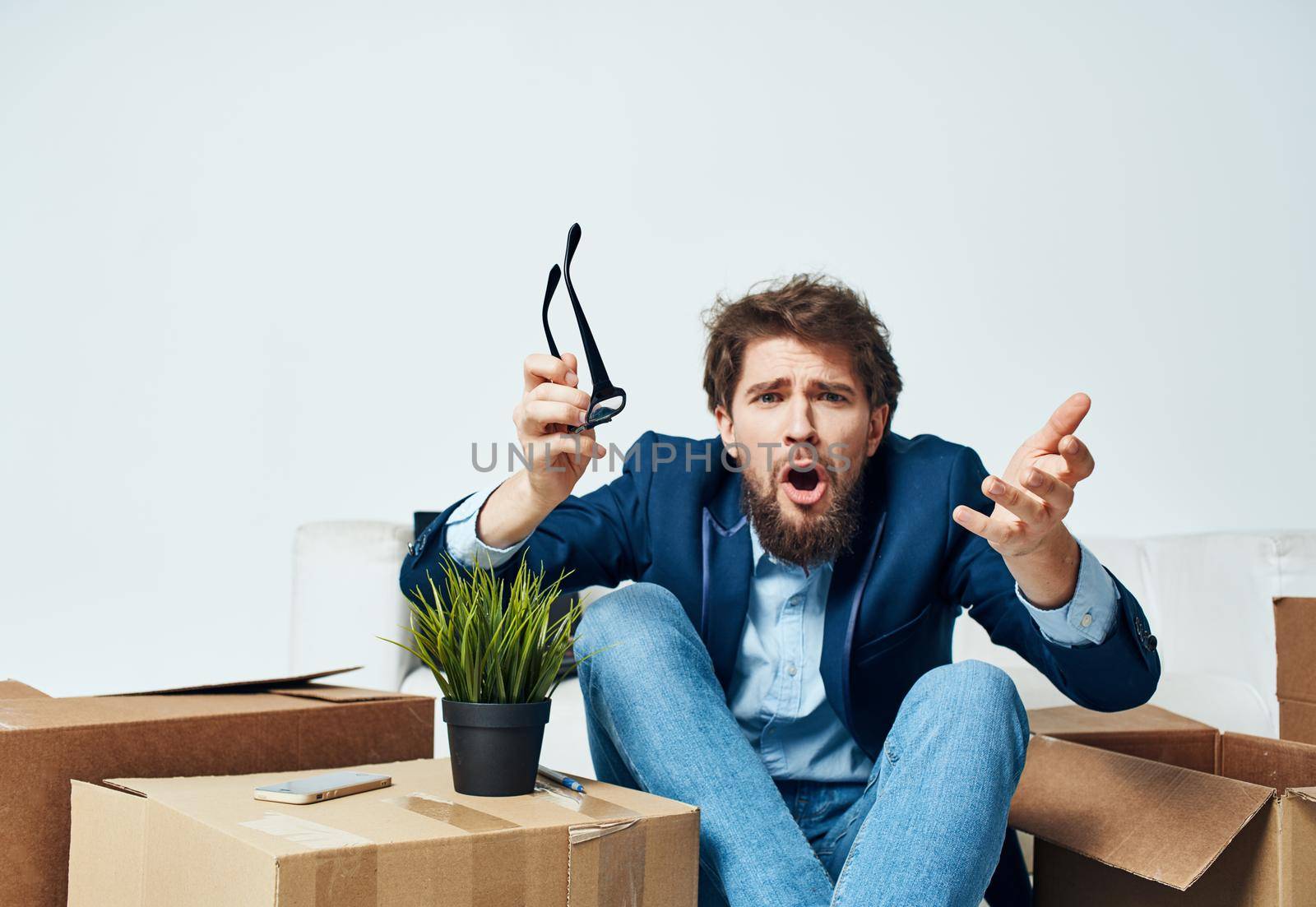 business man office unpacking boxes lifestyle emotions by SHOTPRIME