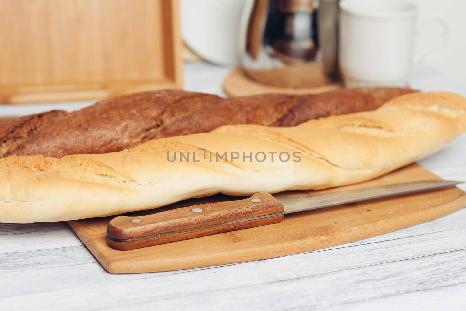 bread on a wooden table kitchen knife baking breakfast. High quality photo