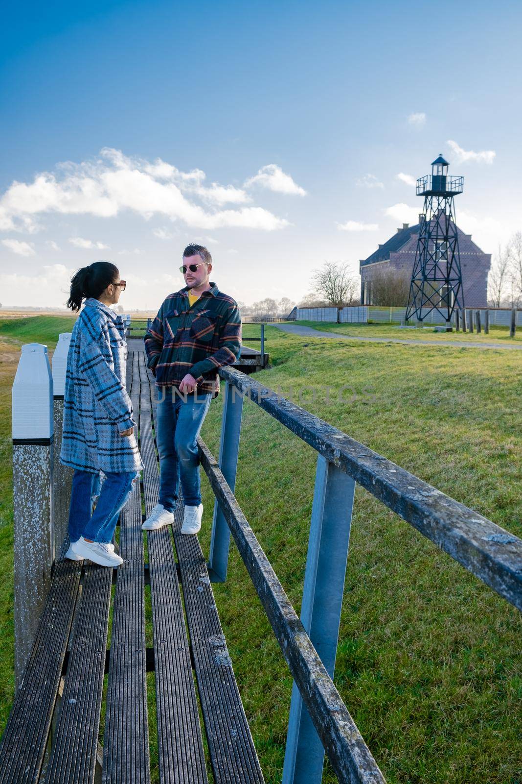 The former island Schokland. couple man and woman visit the former Island Schokland, The former island of Schokland was the first UNESCO World Heritage Site in the Netherlands. Holland