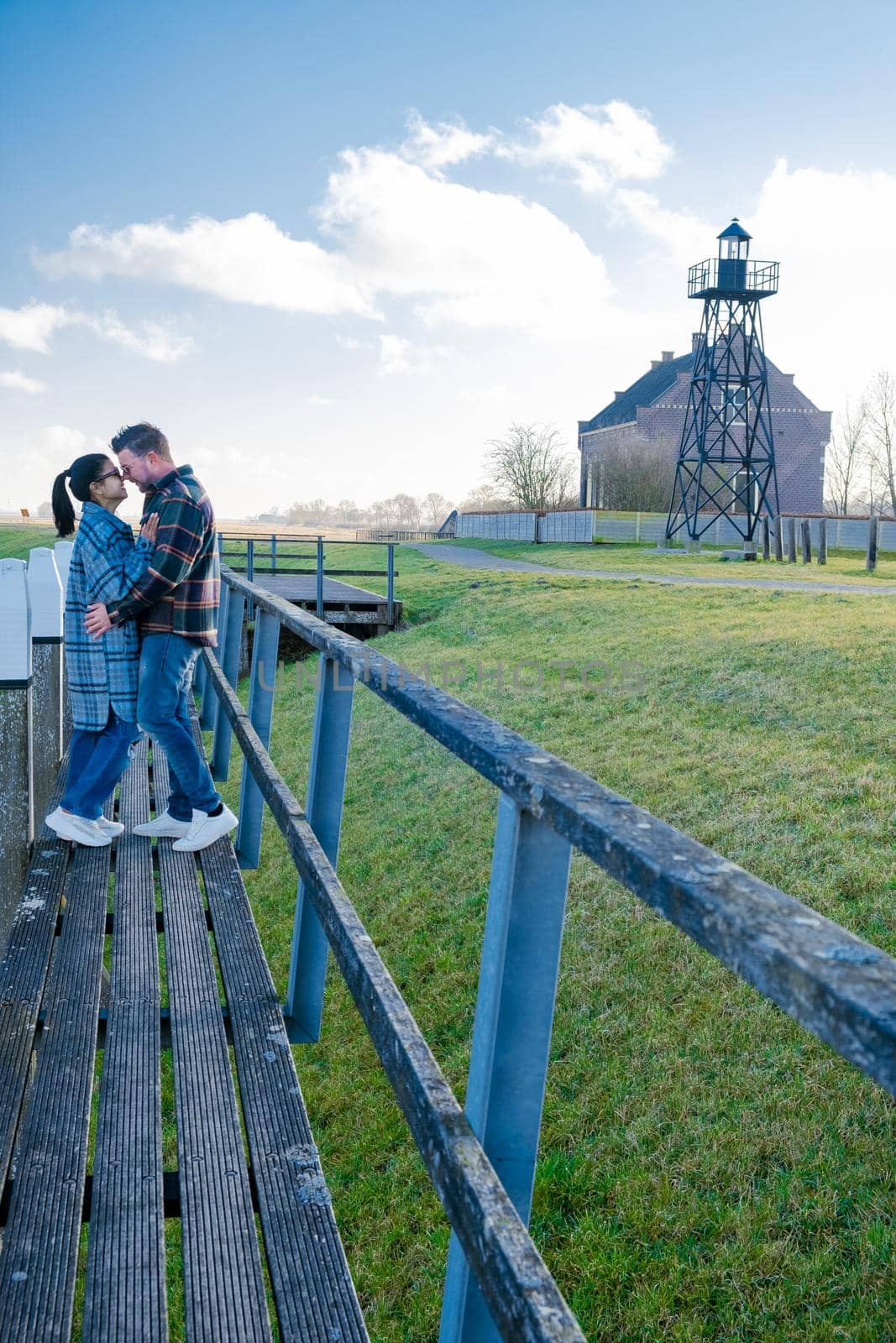 The former island Schokland. couple man and woman visit the former Island Schokland, The former island of Schokland was the first UNESCO World Heritage Site in the Netherlands. Holland