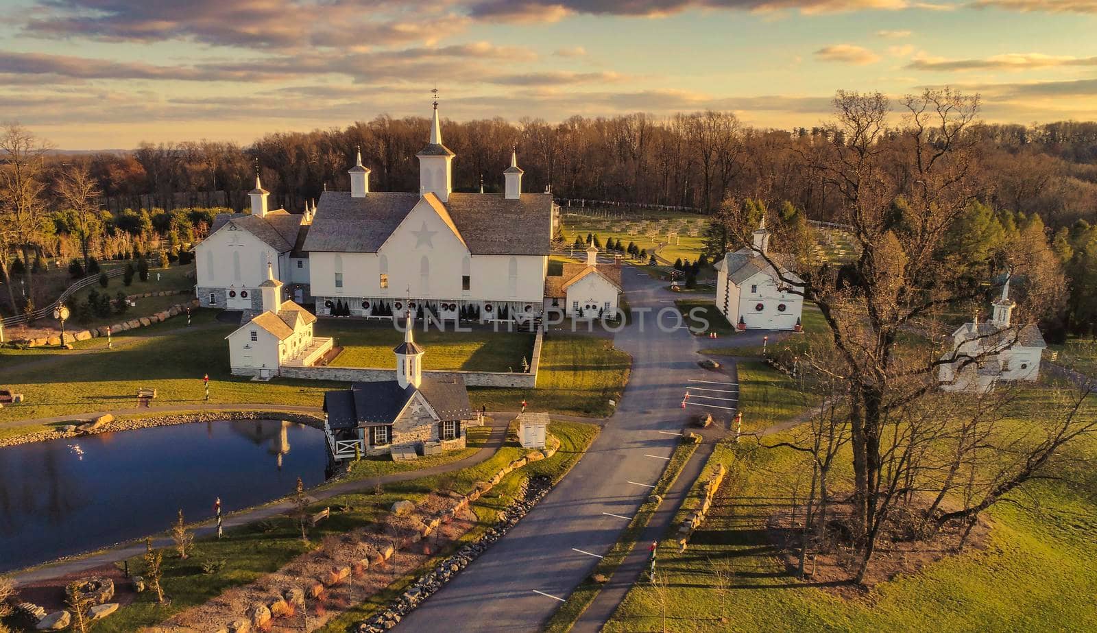 An Aerial View at Sunset of Antique Restored Barns