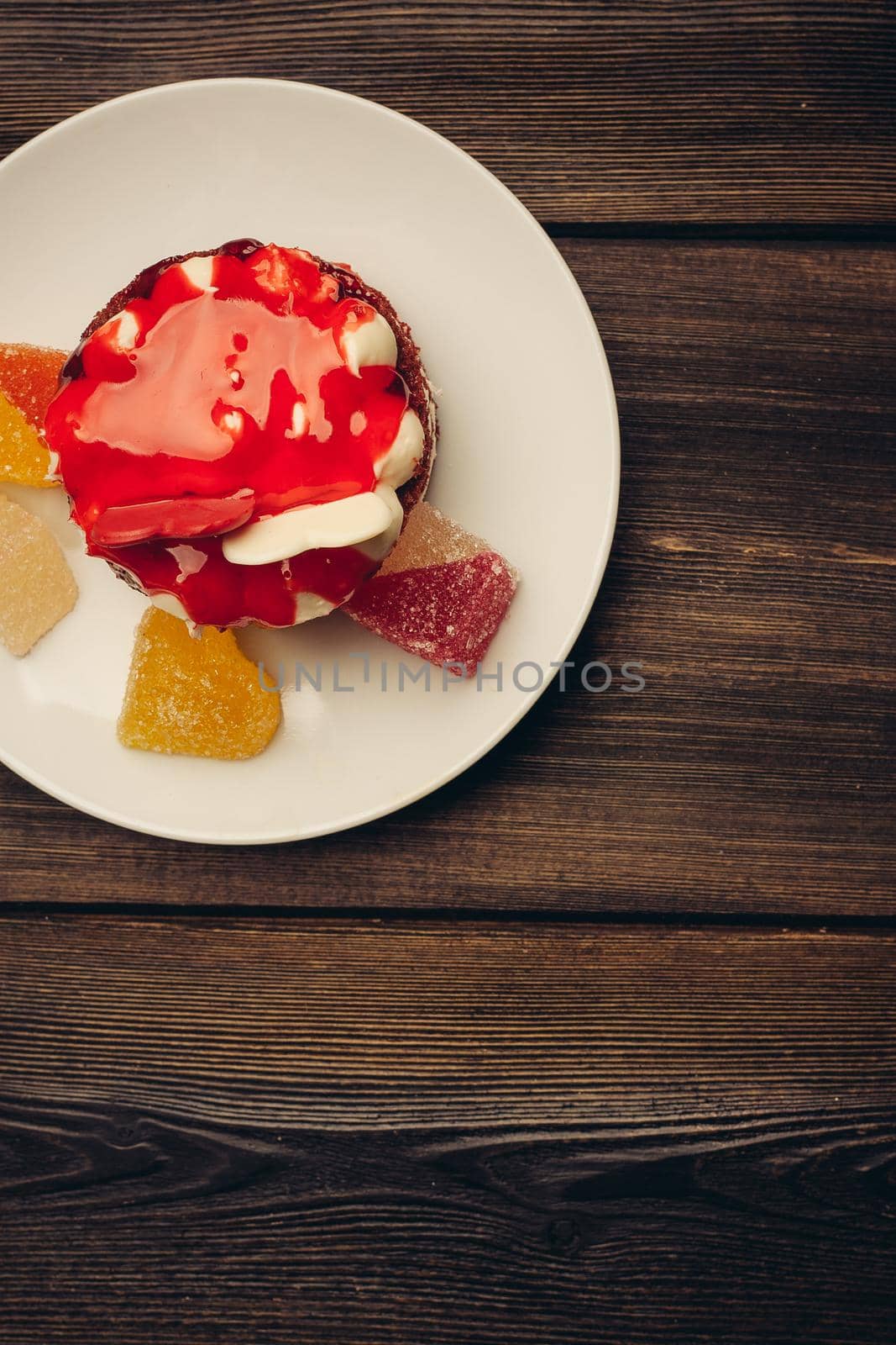 Round red cake on a plate marmalade sweets dessert by SHOTPRIME